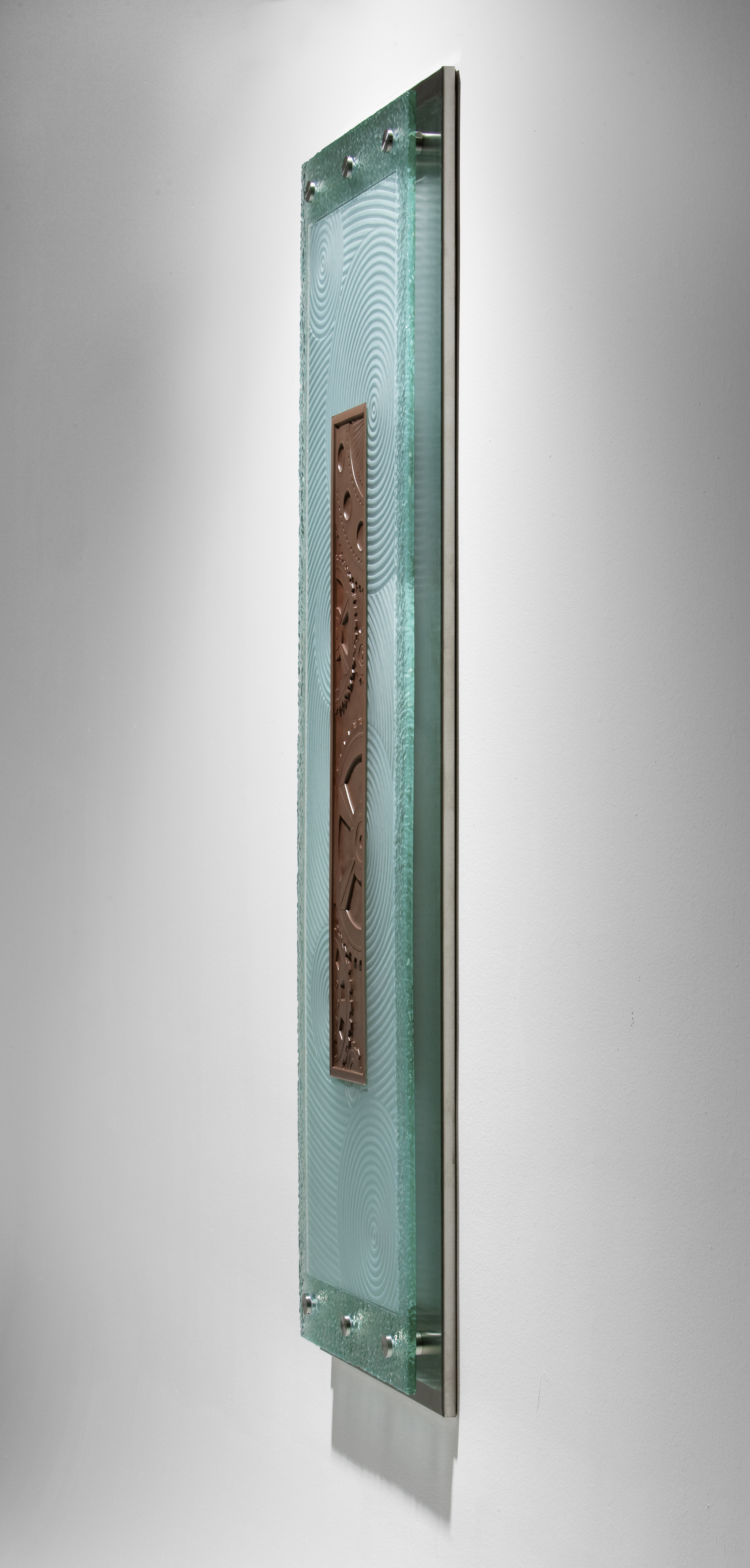Charles Gabriel_Sculptural Glass_hand-carved and kiln-fired art glass_"Chocolate"_ side view of carved and kil-worked glass mounted on wall with stainless hardware
