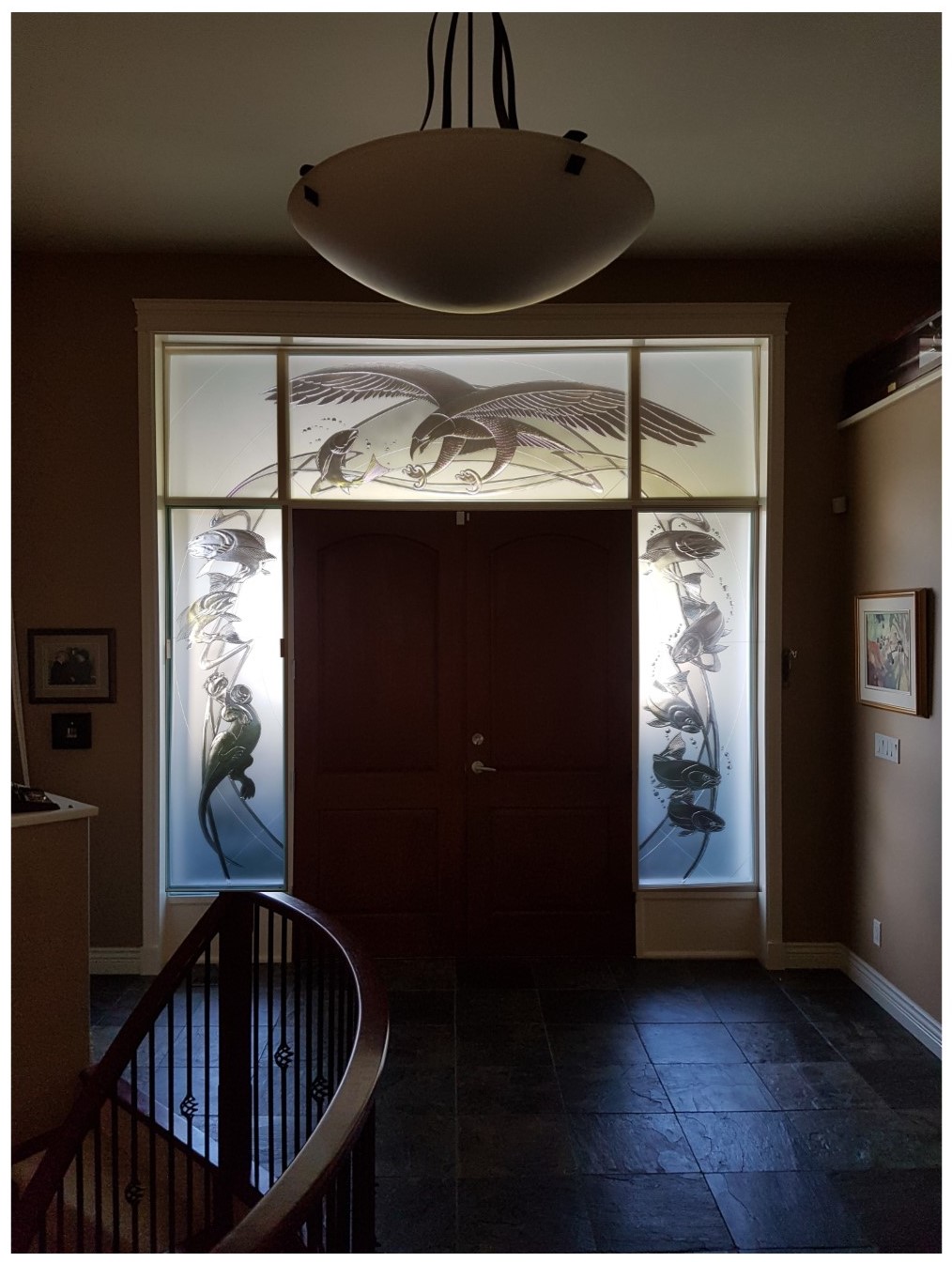 carved glass-etched glass- tempered glass-kiln fired glass-installed specialty glass-residential entry glass-archiectural glass-carved glass eagle-carved glass fish-carved glass otter