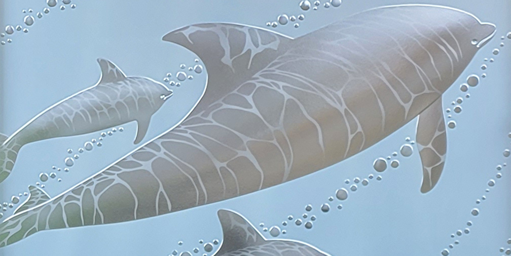 Carved glass dolphins detail